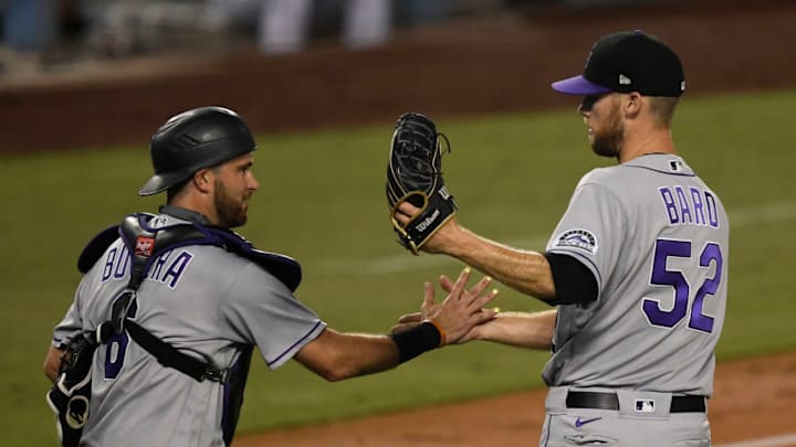 LOS ANGELES, CA - SEPTEMBER 05: Relief pitcher Daniel Bard #52 of the Colorado Rockies celebrates with catcher Drew Butera #6 after defeating the Los Angeles Dodgers, 5-2, at Dodger Stadium on September 5, 2020 in Los Angeles, California. (Photo by Kevork Djansezian/Getty Images)