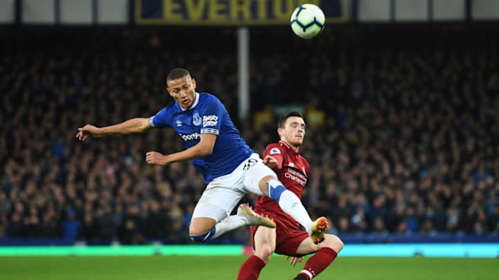 LIVERPOOL, ENGLAND - MARCH 03: Richarlison of Everton battles with Andy Robertson of Liverpool during the Premier League match between Everton FC and Liverpool FC at Goodison Park on March 03, 2019 in Liverpool, United Kingdom. (Photo by Michael Regan/Getty Images)