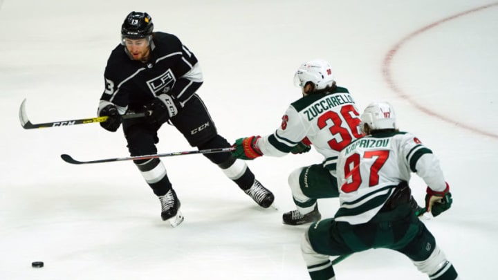 Apr 23, 2021; Los Angeles, California, USA; Los Angeles Kings center Gabriel Vilardi (13) moves the puck against Minnesota Wild right wing Mats Zuccarello (36) and left wing Kirill Kaprizov (97) during the second period at Staples Center. Mandatory Credit: Gary A. Vasquez-USA TODAY Sports