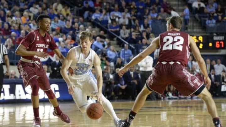 Nov 13, 2015; Annapolis, MD, USA; North Carolina Tar Heels guard Stilman White (30) moves the ball as Temple Owls guard Trey Lowe (11) defends durning the second half of the Veterans Classic at Alumni Hall. North Carolina Tar Heels defeated Temple Owls 91-67. Mandatory Credit: Tommy Gilligan-USA TODAY Sports