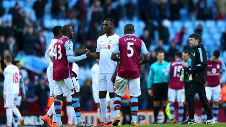 BIRMINGHAM, ENGLAND - FEBRUARY 14: Christian Benteke of Liverpool shakes hands with Aly Cissokho and Jores Okore of Aston Villa after the Barclays Premier League match between Aston Villa and Liverpool at Villa Park on February 14, 2016 in Birmingham, England. (Photo by Michael Steele/Getty Images)