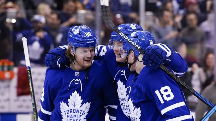 TORONTO, ON – NOVEMBER 30: William Nylander #88 of the Toronto Maple Leafs and teammates Kasperi Kapanen #24 and Andreas Johnsson #18 celebrate after defeating the Buffalo Sabres in overtime at the Scotiabank Arena on November 30, 2019 in Toronto, Ontario, Canada. (Photo by Kevin Sousa/NHLI via Getty Images)