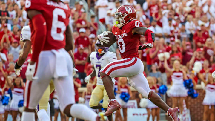 Sep 11, 2021; Norman, Oklahoma, USA; Oklahoma Sooners running back Eric Gray (0) runs for a touchdown during the first quarter against the Western Carolina Catamounts at Gaylord Family-Oklahoma Memorial Stadium. Mandatory Credit: Kevin Jairaj-USA TODAY Sports