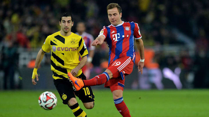 DORTMUND, GERMANY - APRIL 04: (L-R) Henrikh Mkhitaryan of Dortmund vies with Mario Goetze of Muenchen during the Bundesliga match between Borussia Dortmund and FC Bayern Muenchen at Signal Iduna Park on April 4, 2015 in Dortmund, Germany. (Photo by Sascha Steinbach/Getty Images For MAN)