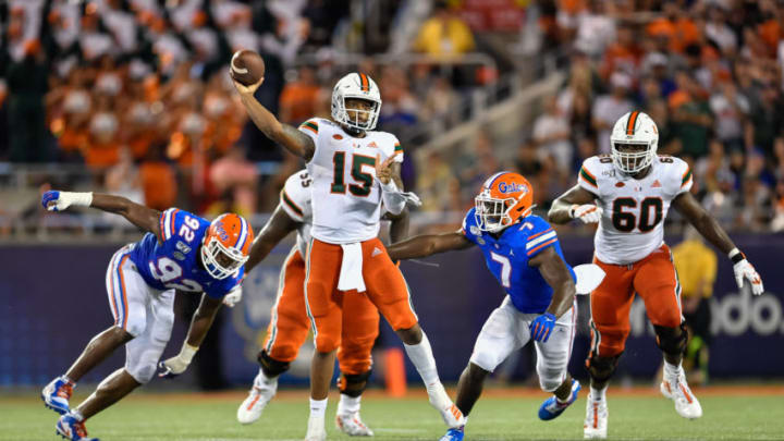 ORLANDO, FL - AUGUST 24: Miami quarterback Jarren Williams (15) throws on the run while pressured by Florida linebacker Jeremiah Moon (7) during the second half of the Camping World Kickoff between the Florida Gators and the Miami Hurricanes on August 24, 2019, at Camping World Stadium in Orlando, FL. (Photo by Roy K. Miller/Icon Sportswire via Getty Images)