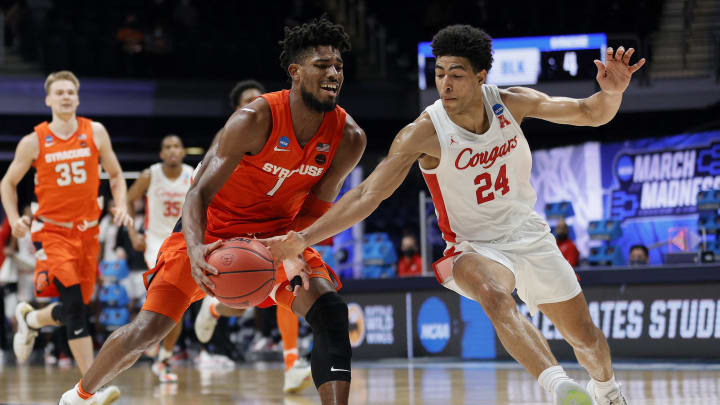 INDIANAPOLIS, INDIANA – MARCH 27: Quentin Grimes #24 of the Houston Cougars looks to steal the ball from Quincy Guerrier #1 of the Syracuse Orange in the second half of their Sweet Sixteen game of the 2021 NCAA Men’s Basketball Tournament at Hinkle Fieldhouse on March 27, 2021 in Indianapolis, Indiana. (Photo by Sarah Stier/Getty Images)