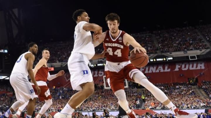 Apr 6, 2015; Indianapolis, IN, USA; Wisconsin Badgers forward Frank Kaminsky (44) drives against Duke Blue Devils center Jahlil Okafor (15) in the second half in the 2015 NCAA Men