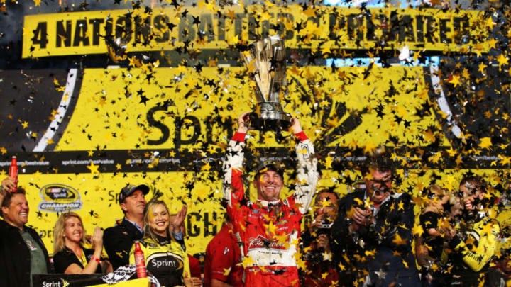 HOMESTEAD, FL - NOVEMBER 16: Kevin Harvick, driver of the #4 Budweiser Chevrolet, celebrates with the trophy in victory lane after winning during the NASCAR Sprint Cup Series Ford EcoBoost 400 at Homestead-Miami Speedway on November 16, 2014 in Homestead, Florida. (Photo by Chris Graythen/Getty Images)