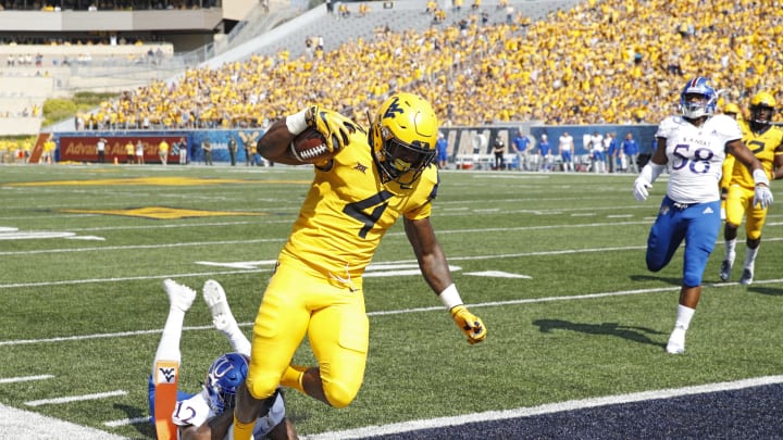 MORGANTOWN, WV – OCTOBER 06: Leddie Brown #4 of the West Virginia Mountaineers runs into the end zone for a 15-yard touchdown after catching a pass against the Kansas Jayhawks in the first quarter of the game at Mountaineer Field on October 6, 2018 in Morgantown, West Virginia. (Photo by Joe Robbins/Getty Images)