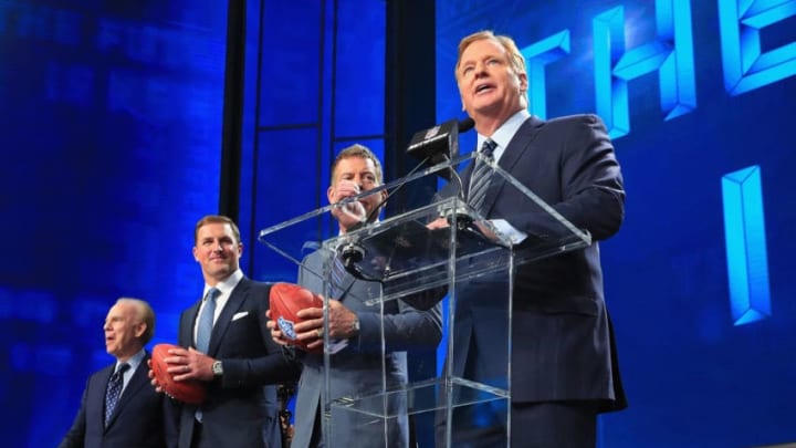ARLINGTON, TX - APRIL 26: NFL Commissioner Roger Goodell stands onstage with Troy Aikman, Jason Witten, and Roger Staubach during the first round of the 2018 NFL Draft at AT
