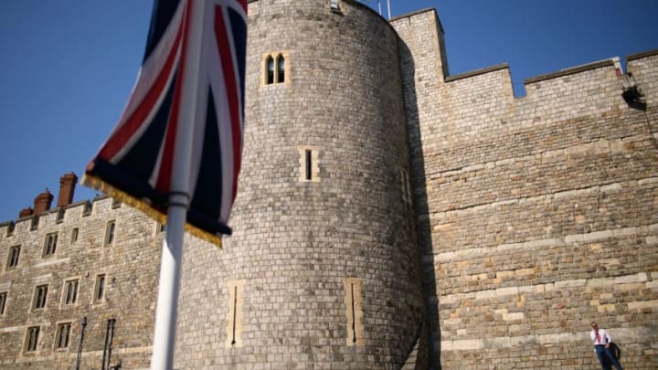 WINDSOR, ENGLAND - MAY 19: A man takes a phone call as he stands in the sun outside Windsor Castle, following the marriage of Prince Harry, Duke of Sussex and the Duchess of Sussex at St George's Chapel on May 19, 2019 in Windsor, England. Prince Henry Charles Albert David of Wales marries Ms. Meghan Markle in a service at St George's Chapel inside the grounds of Windsor Castle. Among the guests were 2,200 members of the public, the royal family and Ms. Markle's Mother Doria Ragland. (Photo by Leon Neal/Getty Images )