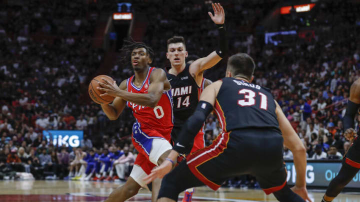 Philadelphia 76ers guard Tyrese Maxey (0) dribbles the basketball against Miami Heat guard Tyler Herro (14)(Sam Navarro-USA TODAY Sports)