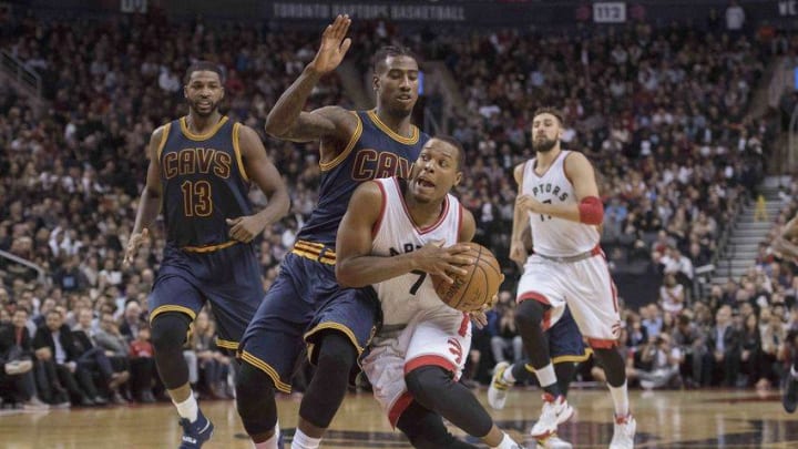Oct 28, 2016; Toronto, Ontario, CAN; Toronto Raptors guard Kyle Lowry (7) dribbles the ball as Cleveland Cavaliers guard Iman Shumpert (4) defends during the fourth quarter in a game at Air Canada Centre. The Cleveland Cavaliers won 94-91. Mandatory Credit: Nick Turchiaro-USA TODAY Sports