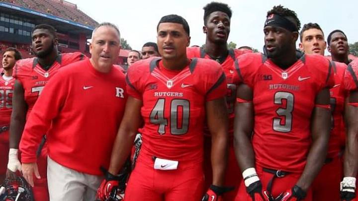 Sep 6, 2014; Piscataway, NJ, USA; Rutgers Scarlet Knights head coach Kyle Flood, Rutgers Scarlet Knights fullback Kevin Marquez (40), and Rutgers Scarlet Knights linebacker Steve Longa (3) celebrate their 38-25 victory over the Howard Bison at High Points Solutions Stadium. Mandatory Credit: Ed Mulholland-USA TODAY Sports