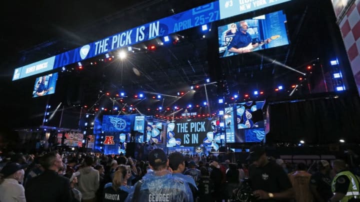 NASHVILLE, TENNESSEE - APRIL 25: Hometown fans of the Tennessee Titans react after their first round pick of Jeffery Simmons is announced on day 1 of the 2019 NFL Draft on April 25, 2019 in Nashville, Tennessee. (Photo by Frederick Breedon/Getty Images)