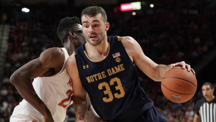 COLLEGE PARK, MD – DECEMBER 04: John Mooney #33 of the Notre Dame Fighting Irish makes a move to the basket against Jalen Smith #25 of the Maryland Terrapins in the first half at Xfinity Center on December 4, 2019 in College Park, Maryland. (Photo by Patrick McDermott/Getty Images)