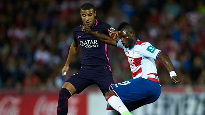 GRANADA, SPAIN - APRIL 02: Uche Henry Agbo of Granada CF (R) being followed by Rafinha Alcantara of FC Barcelona (L) during the La Liga match between Granada CF v FC Barcelona at Estadio Nuevo Los Carmenes on April 02, 2017 in Granada, Spain. (Photo by Aitor Alcalde/Getty Images)