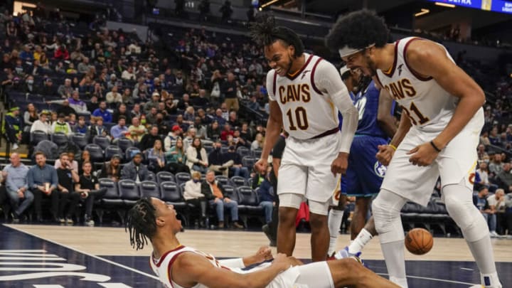 Dec 10, 2021; Minneapolis, Minnesota, USA; Cleveland Cavaliers forward Isaac Okoro (35) reacts to getting the basket and the foul with guard Darius Garland (10) and center Jarrett Allen (31) against the Minnesota Timberwolves during the third quarter at Target Center. Mandatory Credit: Nick Wosika-USA TODAY Sports