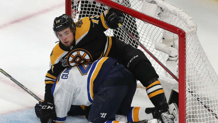 BOSTON, MA - JUNE 6: Bruins Charlie McAvoy lands on top of Blues Carl Gunnarsson in the net late in the third period. The Boston Bruins host the St. Louis Blues in Game 5 of the 2019 Stanley Cup Finals at TD Garden on June 6, 2019. (Photo by John Tlumacki/The Boston Globe via Getty Images)
