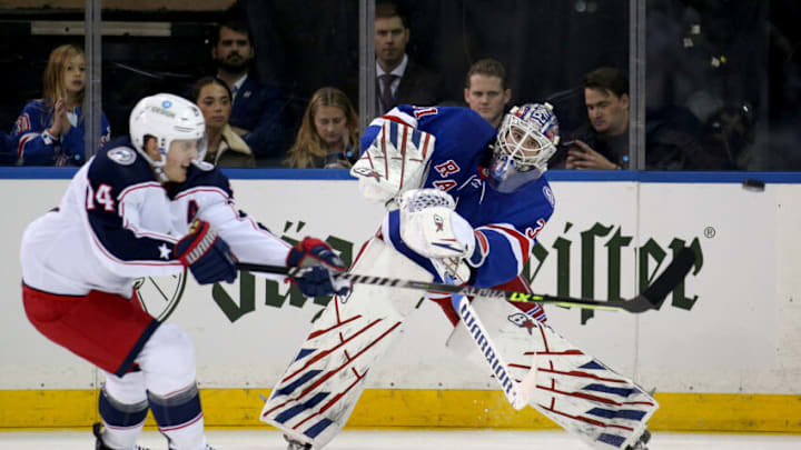 Oct 29, 2021; New York, New York, USA; New York Rangers goaltender Igor Shesterkin (31) plays the puck past Columbus Blue Jackets center Gustav Nyquist (14) during the second period at Madison Square Garden. Mandatory Credit: Brad Penner-USA TODAY Sports