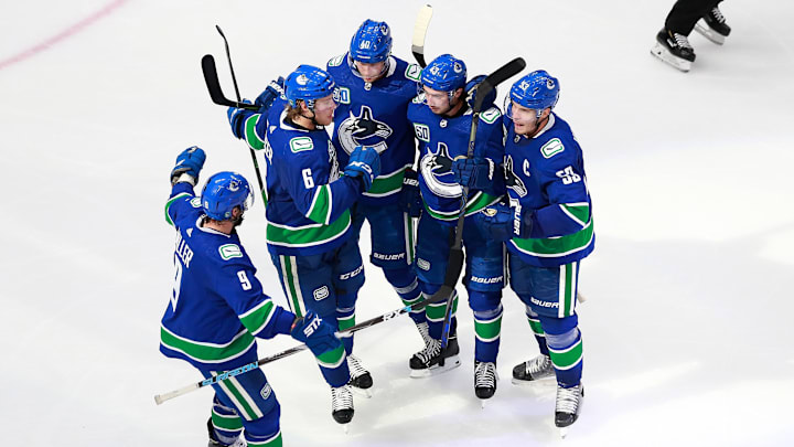 EDMONTON, ALBERTA – AUGUST 04: Bo Horvat #53 of the Vancouver Canucks celebrates his third period goal with Quinn Hughes #43, Elias Pettersson #40 and Brock Boeser #6. (Photo by Jeff Vinnick/Getty Images)