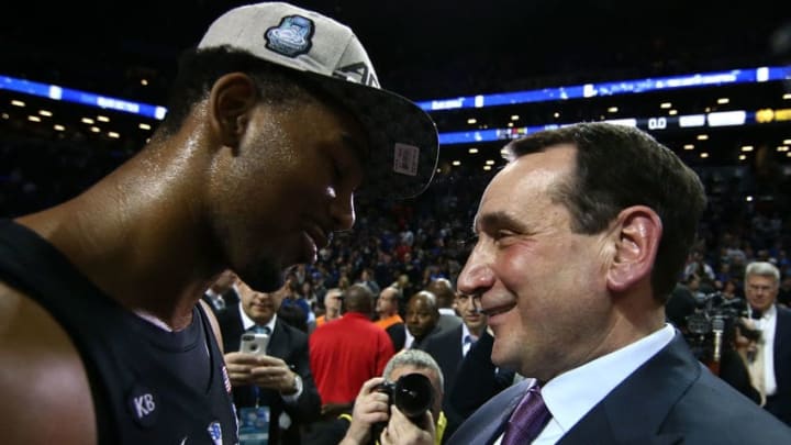 NEW YORK, NY - MARCH 11: Head coach Mike Krzyzewski of the Duke Blue Devils congratulates Matt Jones
