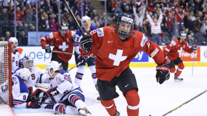 TORONTO, ON - JANUARY 2: Nico Hischier #18 of Team Switzerland celebrates one of his 2 goals against Team USA during a QuarterFinal game at the 2017 IIHF World Junior Hockey Championships at Air Canada Centre on January 2, 2017 in Toronto, Ontario, Canada. Team USA defeated Team Switzerland 3-2. (Photo by Claus Andersen/Getty Images)