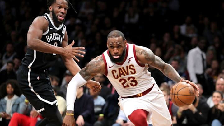 NEW YORK, NY - MARCH 25: LeBron James NEW YORK, NY - MARCH 25: LeBron James #23 of the Cleveland Cavaliers dribbles to the basket against DeMarre Carroll #9 of the Brooklyn Nets in the third quarter during their game at Barclays Center on March 25, 2018 in the Brooklyn borough of New York City. NOTE TO USER: User expressly acknowledges and agrees that, by downloading and or using this photograph, User is consenting to the terms and conditions of the Getty Images License Agreement. (Photo by Abbie Parr/Getty Images)