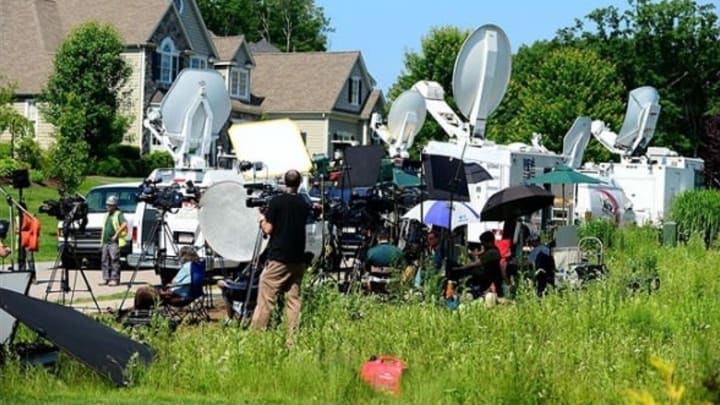June 21 2013; North Attleborough, MA, USA; Media members stake out in front of the house of New England Patriots tight end Aaron Hernandez in North Attleborough, Mass. Mandatory Credit: Andrew Weber-USA TODAY Sports