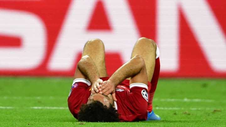 KIEV, UKRAINE - MAY 26: Mohamed Salah of Liverpool reacts after going down injured during the UEFA Champions League Final between Real Madrid and Liverpool at NSC Olimpiyskiy Stadium on May 26, 2018 in Kiev, Ukraine. (Photo by Stuart Franklin - UEFA/UEFA via Getty Images)