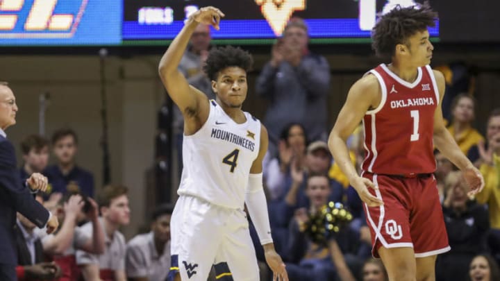 Feb 29, 2020; Morgantown, West Virginia, USA; West Virginia Mountaineers guard Miles McBride (4) celebrates after making a three pointer during the first half against the Oklahoma Sooners at WVU Coliseum. Mandatory Credit: Ben Queen-USA TODAY Sports