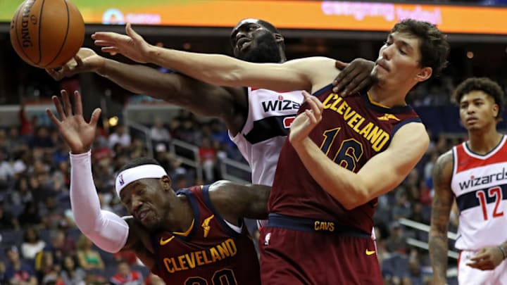 WASHINGTON, DC - OCTOBER 08: Daniel Ochefu #32 of the Washington Wizards battles Cedi Osman #16 of the Cleveland Cavaliers for a rebound in the second half during a preseason game at Capital One Arena on October 8, 2017 in Washington, DC. NOTE TO USER: User expressly acknowledges and agrees that, by downloading and or using this photograph, User is consenting to the terms and conditions of the Getty Images License Agreement. (Photo by Patrick Smith/Getty Images)