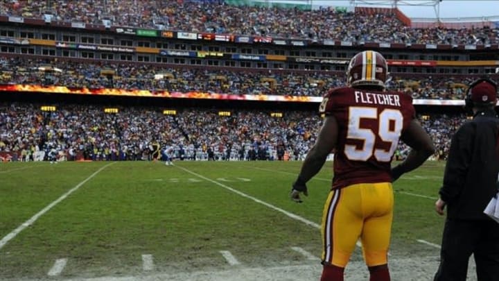 Dec 8, 2013; Landover, MD, USA; Washington Redskins linebacker London Fletcher (59) looks on from the sidelines against the Dallas Cowboys during the second half at FedEx Field. Mandatory Credit: Brad Mills-USA TODAY Sports