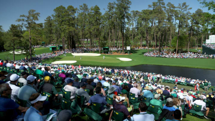 AUGUSTA, GEORGIA - APRIL 07: (EDITOR'S NOTE: This image was created using a polarizing filter). Fans look on to 16th green the during the first round of the Masters at Augusta National Golf Club on April 07, 2022 in Augusta, Georgia. (Photo by Andrew Redington/Getty Images)