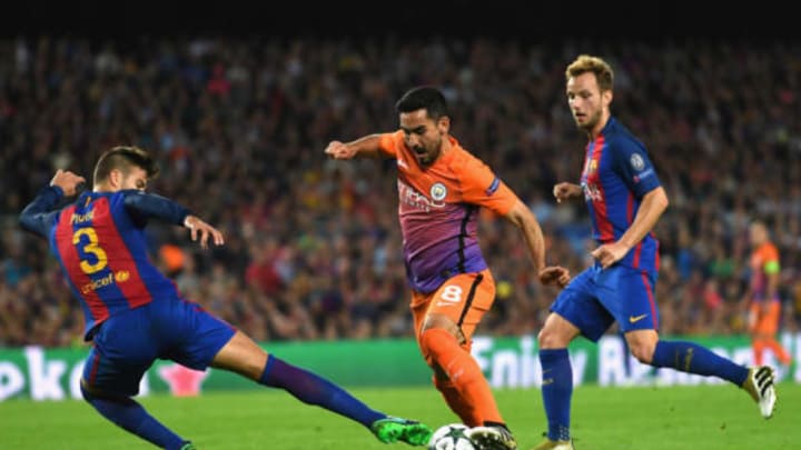 BARCELONA, SPAIN – OCTOBER 19: Ilkay Gundogan of Manchester City dribbles past Gerard Pique of Barcelona during the UEFA Champions League group C match between FC Barcelona and Manchester City FC at Camp Nou on October 19, 2016 in Barcelona, Spain. (Photo by Shaun Botterill/Getty Images)