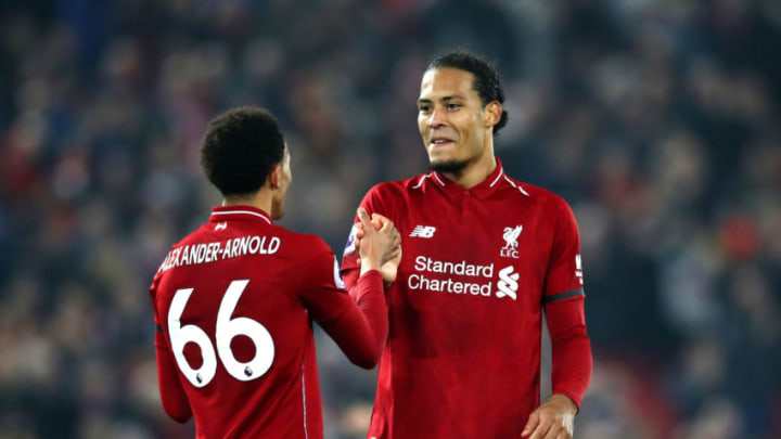 LIVERPOOL, ENGLAND - FEBRUARY 27: Virgil van Dijk of Liverpool and Trent Alexander-Arnold of Liverpool shake hands during the Premier League match between Liverpool FC and Watford FC at Anfield on February 27, 2019 in Liverpool, United Kingdom. (Photo by Clive Brunskill/Getty Images)