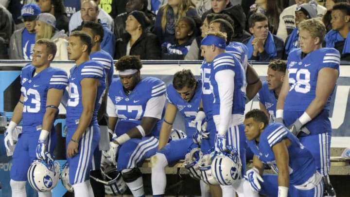 PROVO, UT - OCTOBER 3: A dejected Brigham Young Cougars bench watches the clock tick down on their unbeaten season, as they lost to the Utah State Aggies 35-20 at LaVell Edwards Stadium on October 3, 2014 in Provo, Utah. (Photo by Gene Sweeney Jr/Getty Images )