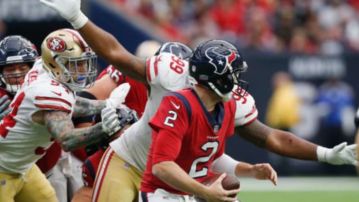 HOUSTON, TX – DECEMBER 10: T.J. Yates #2 of the Houston Texans looks for a receiver as DeForest Buckner #99 of the San Francisco 49ers closes in at NRG Stadium on December 10, 2017 in Houston, Texas. (Photo by Bob Levey/Getty Images)