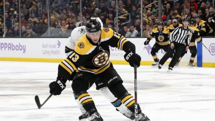 BOSTON, MA - OCTOBER 29: Boston Bruins center Charlie Coyle (13) corrals the puck during a game between the Boston Bruins and the San Jose Sharks on October 29, 2019, at TD Garden in Boston, Massachusetts. (Photo by Fred Kfoury III/Icon Sportswire via Getty Images)
