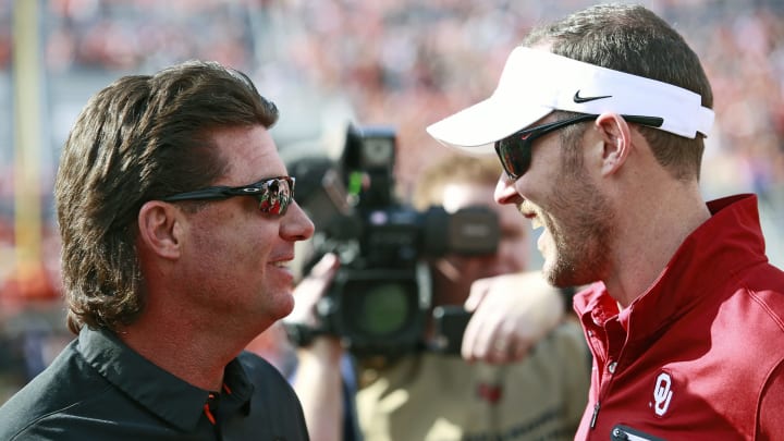 STILLWATER, OK – NOVEMBER 04: Head coach Mike Gundy of the Oklahoma State Cowboys and head coach Lincoln Riley of the Oklahoma Sooners meet on the field before the game at Boone Pickens Stadium on November 4, 2017 in Stillwater, Oklahoma. Oklahoma defeated Oklahoma State 62-52. (Photo by Brett Deering/Getty Images)
