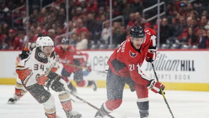 WASHINGTON, DC - NOVEMBER 18: Garnet Hathaway #21 of the Washington Capitals skates with the puck against Sam Steel #34 of the Anaheim Ducks in the first period at Capital One Arena on November 18, 2019 in Washington, DC. (Photo by Patrick McDermott/NHLI via Getty Images)