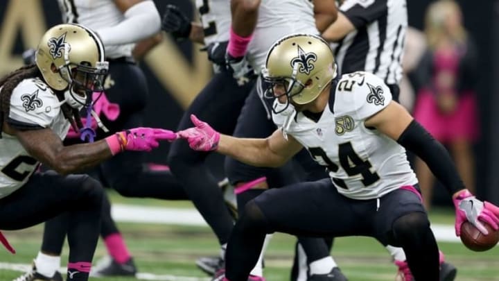 Oct 16, 2016; New Orleans, LA, USA; New Orleans Saints cornerback Sterling Moore (24) celebrates an interception against the Carolina Panthers in the second quarter of their game at the Mercedes-Benz Superdome. Mandatory Credit: Chuck Cook-USA TODAY Sports