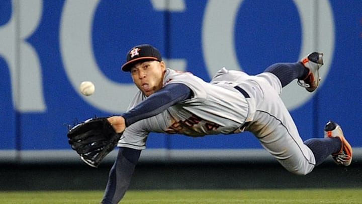 June 28, 2016; Anaheim, CA, USA; Houston Astros right fielder George Springer (4) catches a fly ball in the eighth inning against Los Angeles Angels at Angel Stadium of Anaheim. Mandatory Credit: Gary A. Vasquez-USA TODAY Sports