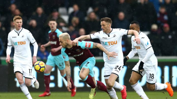 SWANSEA, WALES - MARCH 03: Marko Arnautovic of West Ham United is challenged by Andy King of Swansea City during the Premier League match between Swansea City and West Ham United at Liberty Stadium on March 3, 2018 in Swansea, Wales. (Photo by Jan Kruger/Getty Images)