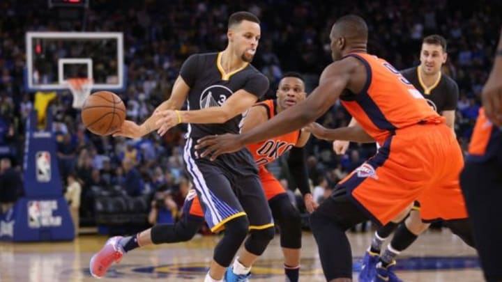 Feb 6, 2016; Oakland, CA, USA; Golden State Warriors guard Stephen Curry (30) passes the ball around Oklahoma City Thunder forward Serge Ibaka (9) in the third quarter at Oracle Arena. The Warriors won 116-108. Mandatory Credit: Cary Edmondson-USA TODAY Sports