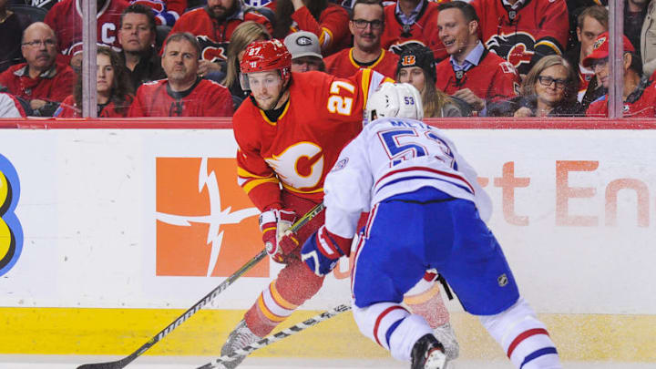 CALGARY, AB - NOVEMBER 15: Austin Czarnik #27 of the Calgary Flames carries the puck against Victor Mete #53 of the Montreal Canadiens during an NHL game at Scotiabank Saddledome on November 15, 2018 in Calgary, Alberta, Canada. (Photo by Derek Leung/Getty Images) CALGARY, AB - NOVEMBER 15: Austin Czarnik #27 of the Calgary Flames carries the puck against Victor Mete #53 of the Montreal Canadiens during an NHL game at Scotiabank Saddledome on November 15, 2018 in Calgary, Alberta, Canada. (Photo by Derek Leung/Getty Images)