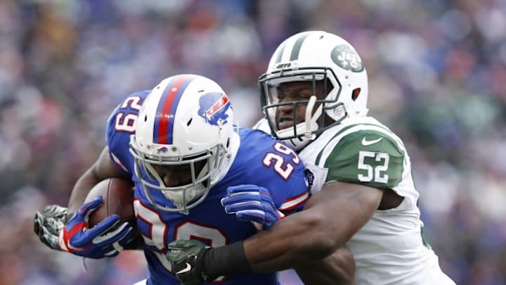 Jan 3, 2016; Orchard Park, NY, USA; New York Jets inside linebacker David Harris (52) tackles Buffalo Bills running back Karlos Williams (29) as he runs the ball during the first half at Ralph Wilson Stadium. Mandatory Credit: Timothy T. Ludwig-USA TODAY Sports