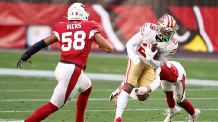 GLENDALE, ARIZONA – DECEMBER 26: Running back Jerick McKinnon #28 of the San Francisco 49ers carries the ball as linebacker Jordan Hicks #58 of the Arizona Cardinals defends during the first half at State Farm Stadium on December 26, 2020 in Glendale, Arizona. (Photo by Christian Petersen/Getty Images)