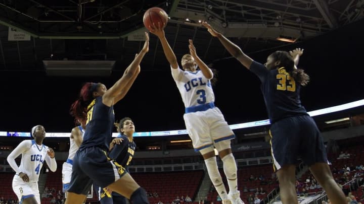 Mar 5, 2016; Seattle , WA, USA; UCLA Bruins guard Jordin Canada (3) is defended by California Golden Bears forward Kristine Anigwe (31) and guard Gabby Green (33) during a womens semifinal in the Pac-12 Conference tournament at KeyArena. UCLA defeated California 73-66 in overtime. Mandatory Credit: Kirby Lee-USA TODAY Sports