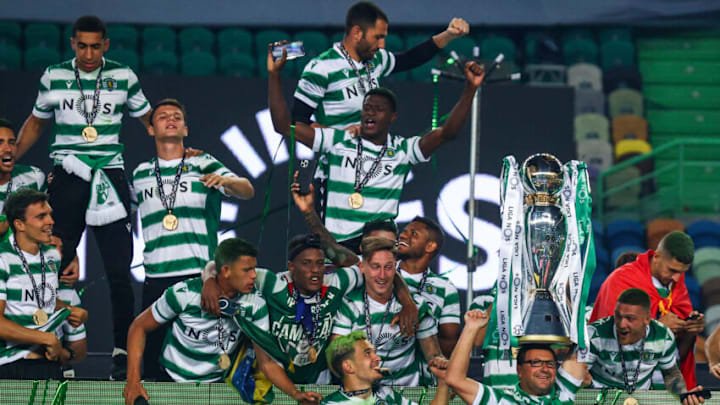 LISBON, PORTUGAL - MAY 11: Sporting CP players celebrate with the trophy wining the game and become Champions at the of the match of the Liga NOS match between Sporting CP and Boavista FC at Estadio Jose Alvalade on May 11, 2021 in Lisbon, Portugal. (Photo by Carlos Rodrigues/Getty Images)